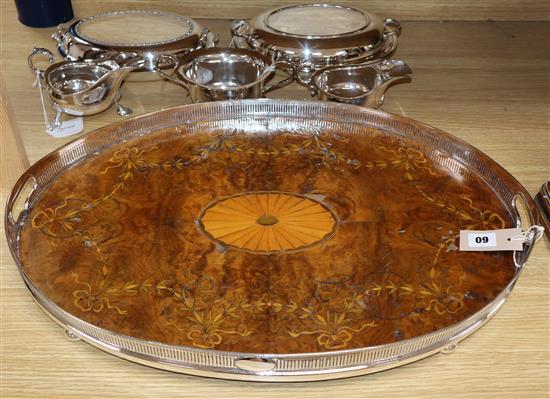 A large plated oval tray, marquetry-inlaid, a pair of entree dishes and three other plated items
